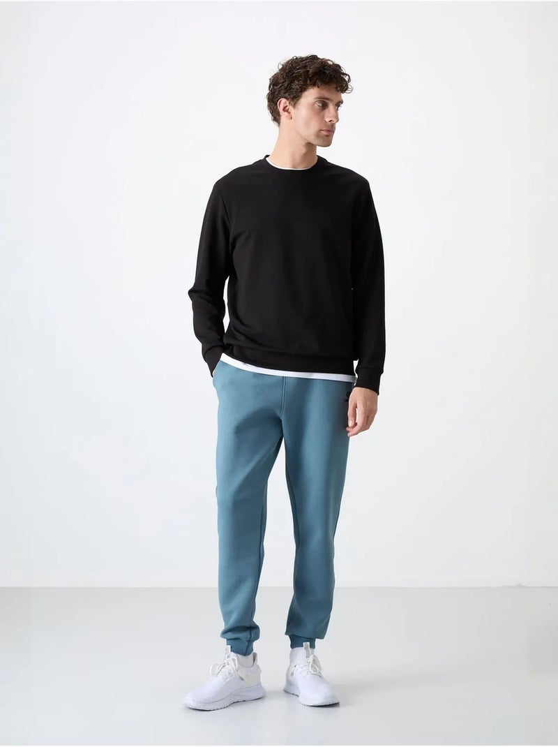 Sudadera lisa de hombre con cuello redondo tommy Negro - Kiabi