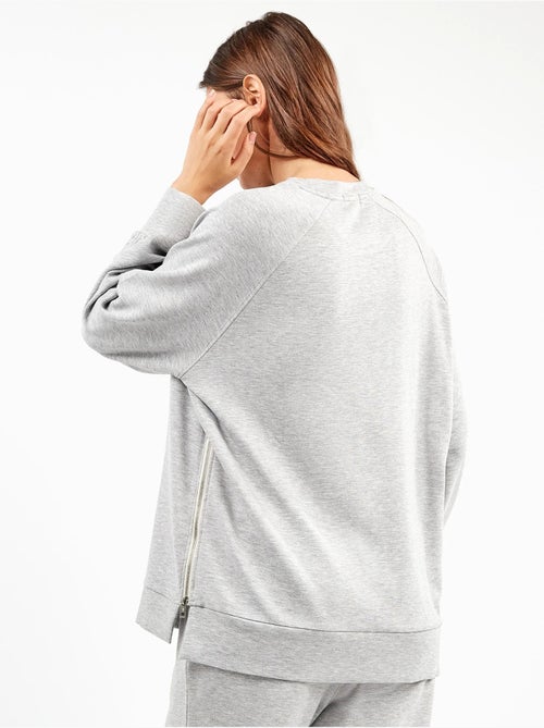 Sudadera oversize con cremalleras en tejido double soft touch - Kiabi Sudadera oversize con cremalleras en tejido double soft touch - Kiabi