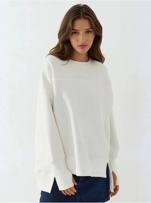 Sudadera oversize de cuello redondo con abertura frontal blanca hiccup - Kiabi Sudadera oversize de cuello redondo con abertura frontal blanca hiccup - Kiabi