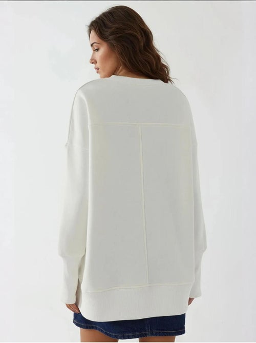 Sudadera oversize de cuello redondo con abertura frontal blanca hiccup - Kiabi Sudadera oversize de cuello redondo con abertura frontal blanca hiccup - Kiabi