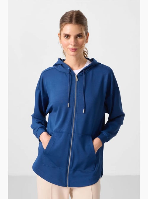 Sudadera túnica larga oversize con capucha y cremallera tommy - Kiabi Sudadera túnica larga oversize con capucha y cremallera tommy - Kiabi
