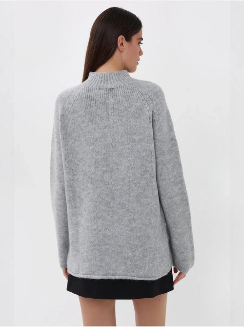 Suéter de punto de cuello alto de gran tamaño - Kiabi Suéter de punto de cuello alto de gran tamaño - Kiabi