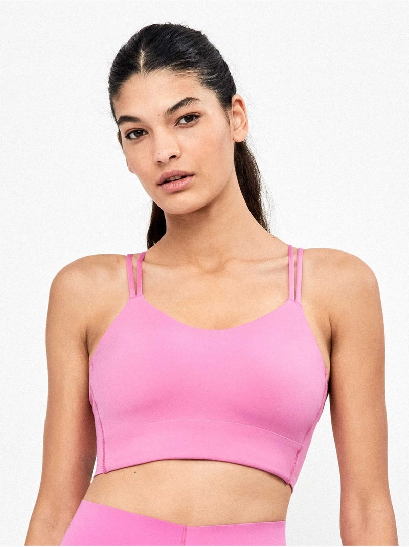 Sujetador deportivo de media sujeción con espalda cruzada Rosa - Kiabi