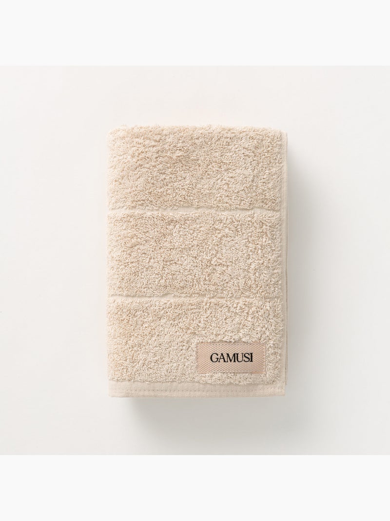 Toalla 100% algodón, rizo 600g/m2, con colgador - Gamusi Arena - Kiabi
