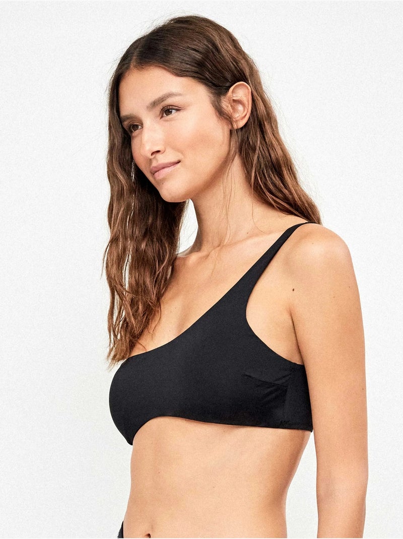 Top bikini asimétrico sin aro y foam extraíble en liso Negro - Kiabi