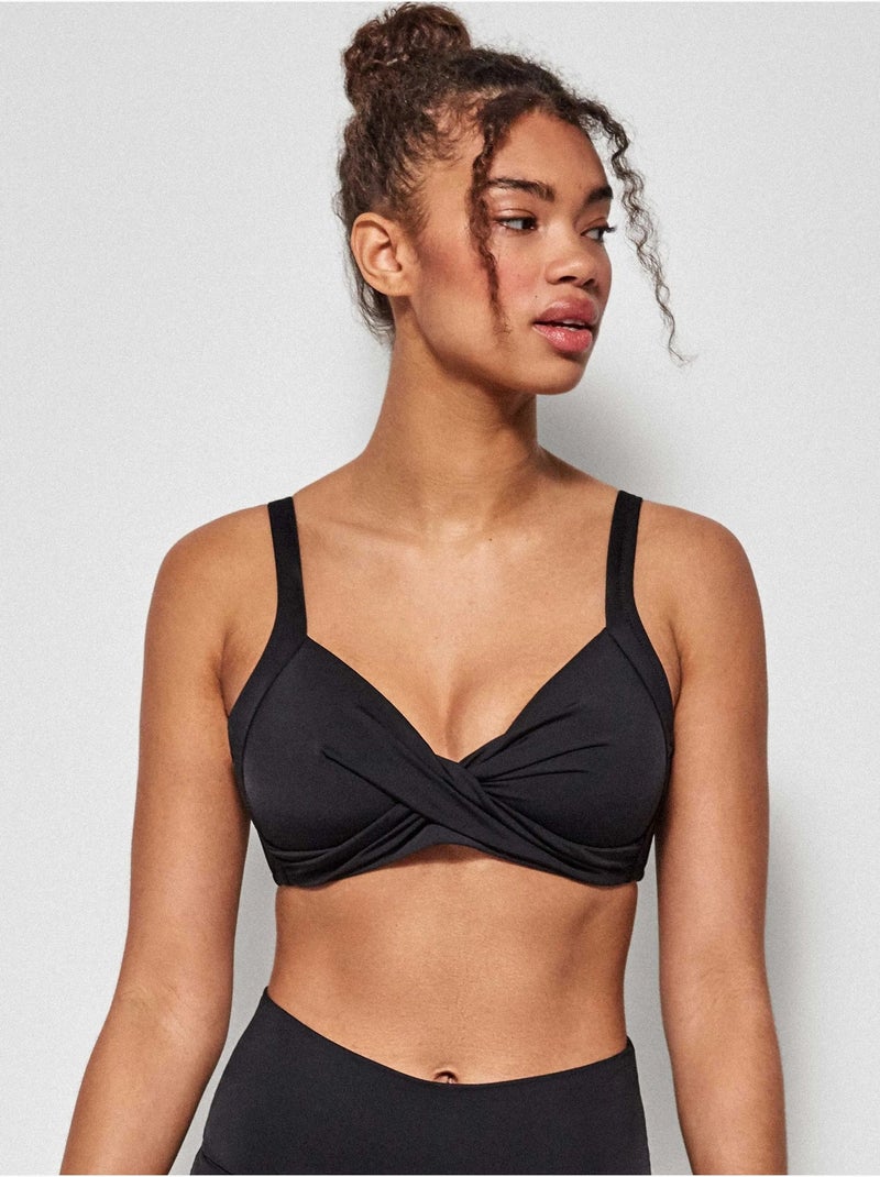 Top bikini capacidad sin aro, con foam y cruce de tejido en escote Negro - Kiabi