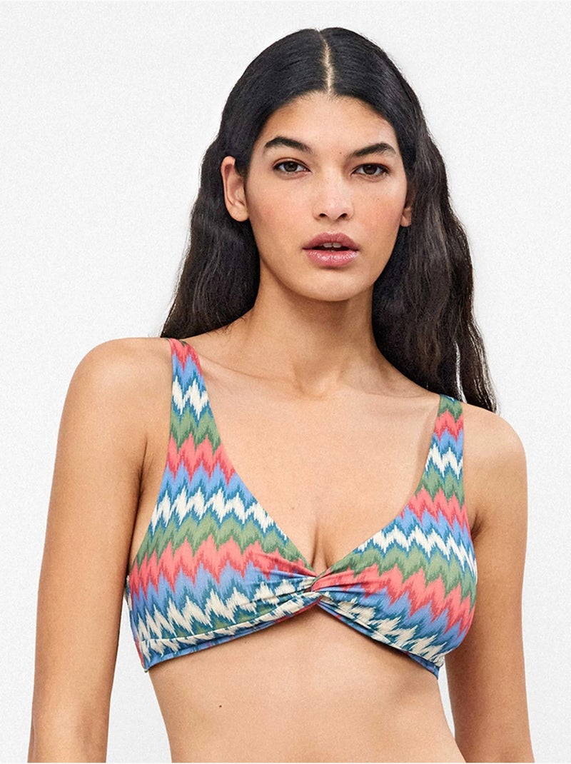 Top bikini sin aro, con foam extraíble,  estampado y cruce pecho Multicolor - Kiabi
