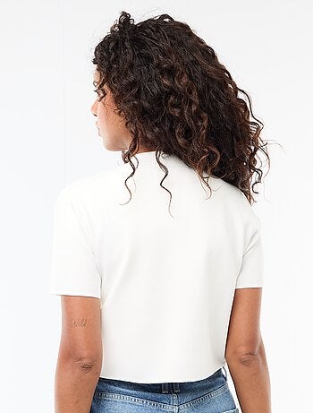 Top de punto con cierre en el cuello