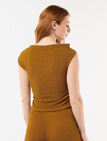 Top elástico liso asimétrico sin mangas