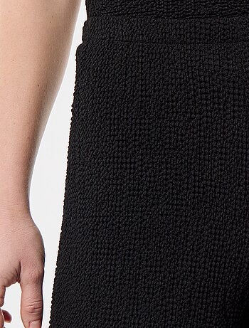 Top elástico liso asimétrico sin mangas