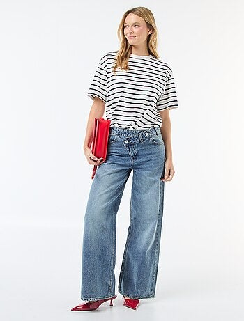 Vaquero ancho con doble abertura abotonada