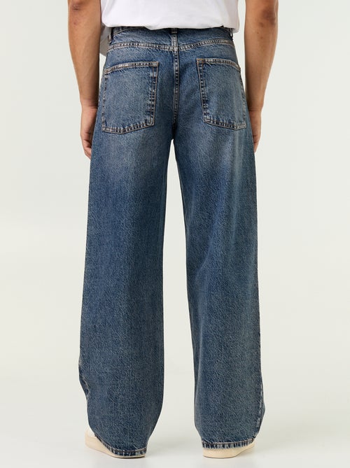 Vaquero baggy liso con apliques de fantasía - Kiabi Vaquero baggy liso con apliques de fantasía - Kiabi