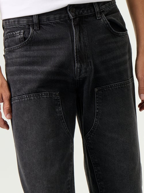 Vaquero baggy liso con apliques de fantasía - Kiabi Vaquero baggy liso con apliques de fantasía - Kiabi