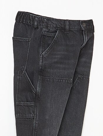 Vaquero con cortes en las rodillas