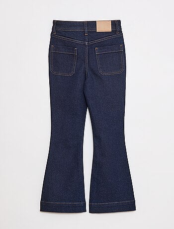 Vaquero corte flare/bootcut con bolsillos de parche