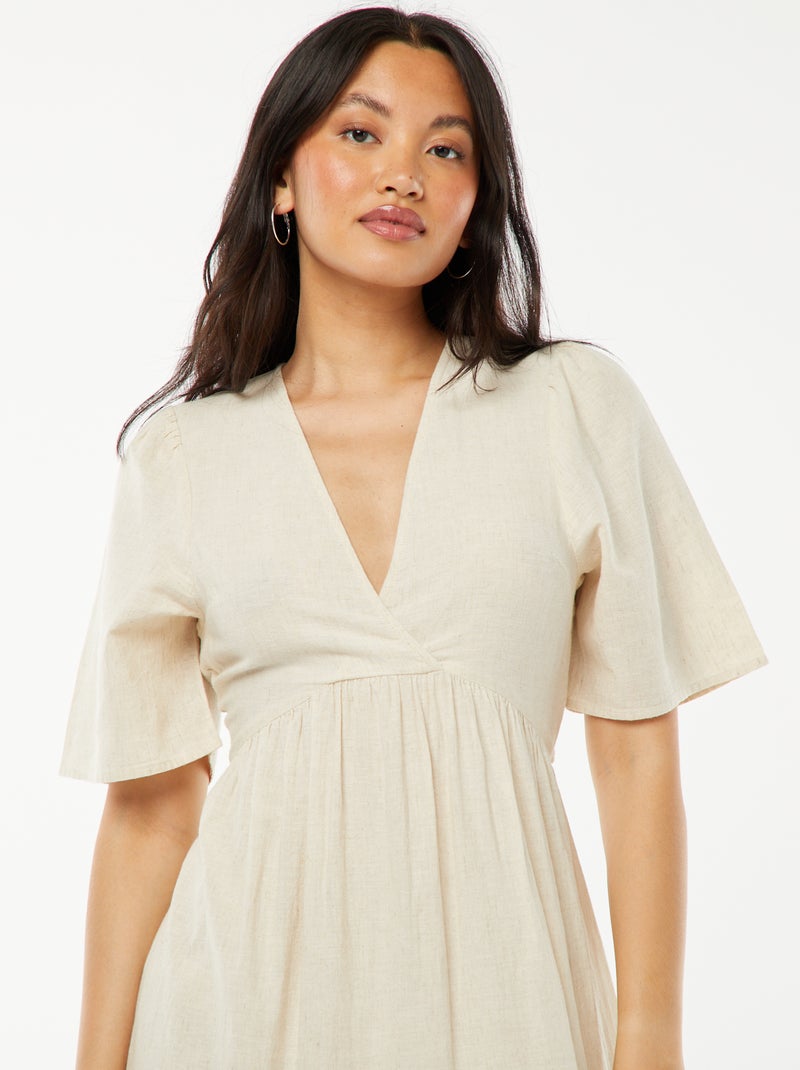 Vestido largo con volante en el bajo y espalda descubierta BEIGE - Kiabi