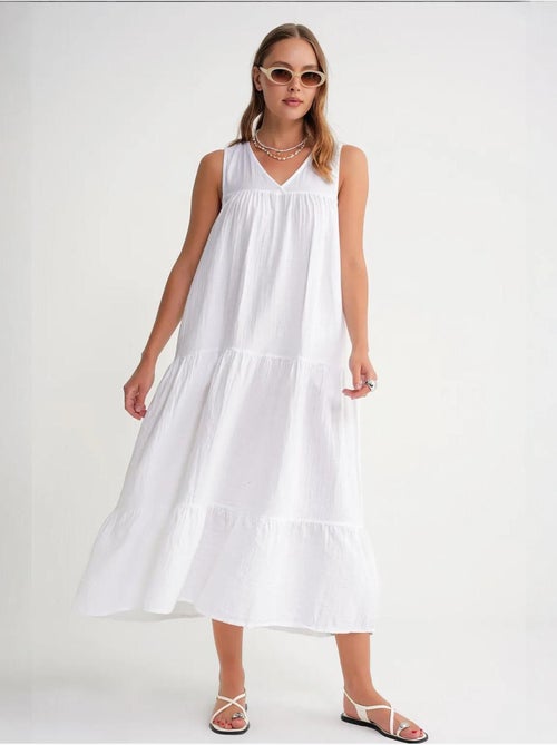 Vestido midi de muselina con cuello en v, sin mangas y bolsillos de mixray - Kiabi Vestido midi de muselina con cuello en v, sin mangas y bolsillos de mixray - Kiabi