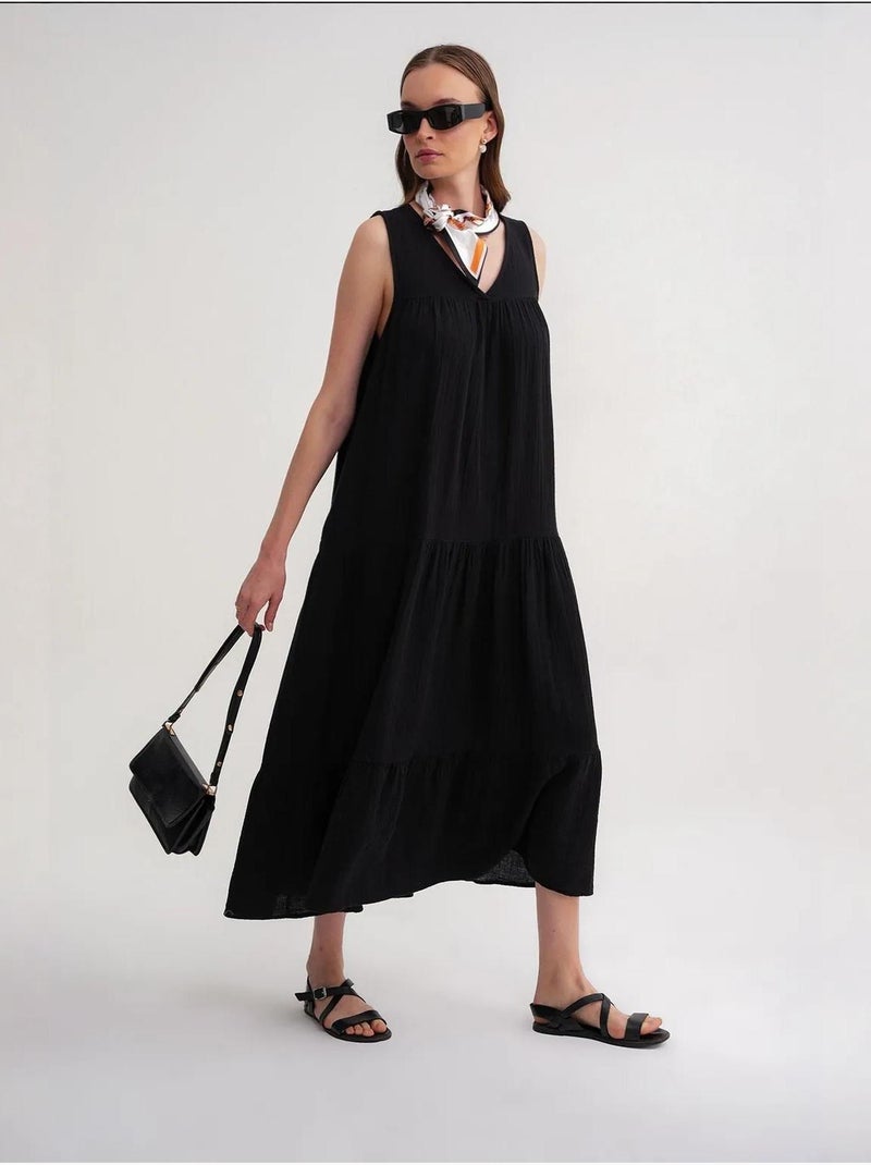 Vestido midi de muselina con cuello en v, sin mangas y bolsillos de mixray Negro - Kiabi