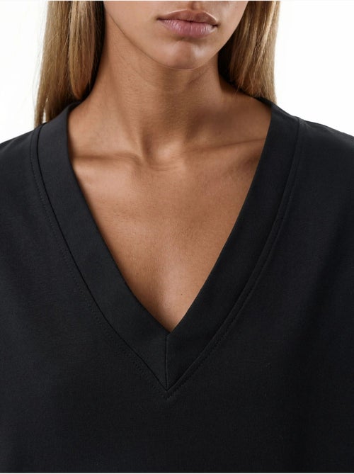 Vestido midi holgado con cuello de pico busem - Kiabi Vestido midi holgado con cuello de pico busem - Kiabi