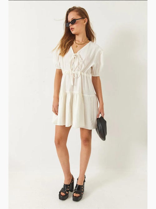 Vestido mini tamara con escote en v y lazo delantero lucci - Kiabi Vestido mini tamara con escote en v y lazo delantero lucci - Kiabi