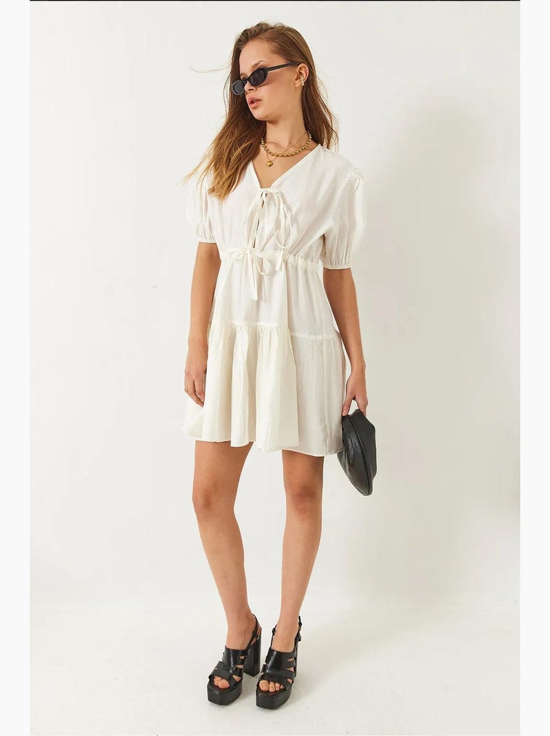 Vestido mini tamara con escote en v y lazo delantero lucci Beige arcilla - Kiabi
