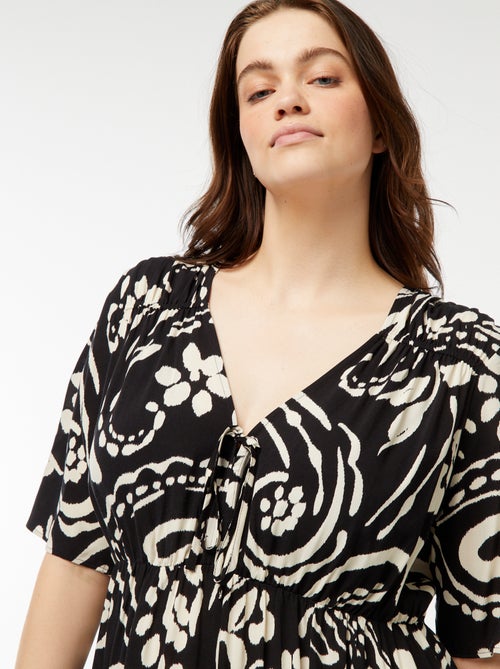 Vestido trapecio estampado con volante en el bajo - Kiabi