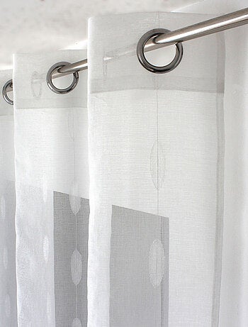 Visillo jacquard con lunares ovalados y ojales metálicos