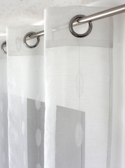 Visillo jacquard con lunares ovalados y ojales metálicos - Kiabi Visillo jacquard con lunares ovalados y ojales metálicos - Kiabi