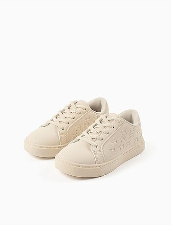 Zapatillas bajas con lazos en relieve y cordones elásticos
