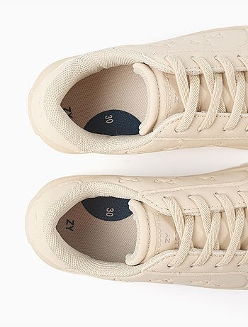 Zapatillas bajas con lazos en relieve y cordones elásticos